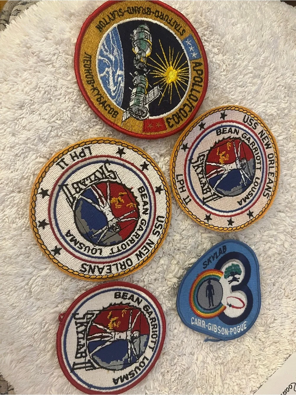 A collection of 4 embroidered NASA mission patches. See description for details.